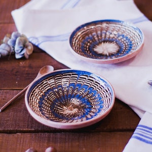 Set of two handmade Horezu plates in blue and brown terracotta