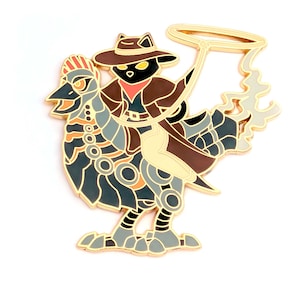 May include: A gold-colored metal pin featuring a cat wearing a cowboy hat and riding a stylized rooster. The rooster is primarily blue, gray, and orange, with gold accents. The cat is black with yellow eyes, wearing a red bandana and brown jacket.
