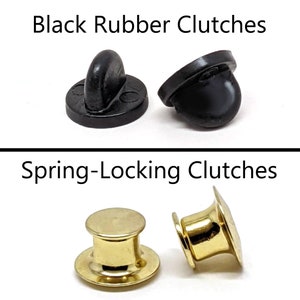 May include: Two black rubber pin back closures and two gold spring-locking pin back closures.  Black Rubber Clutches and Spring-Locking Clutches are written above the closures.