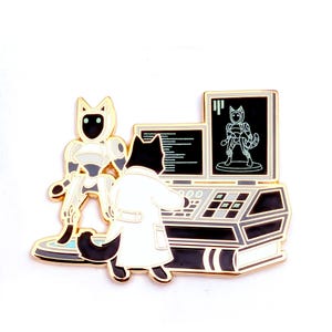 May include: A gold-toned metal enamel pin featuring a black cat in a white lab coat operating a computer console. Next to the console stands a white and grey robot on a circular platform. The computer screens display code and a robot schematic.