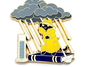 May include: A black cat wearing a yellow raincoat stands on a blue book with a gray cloud raining down on it. The cat is holding an umbrella and the book is open.