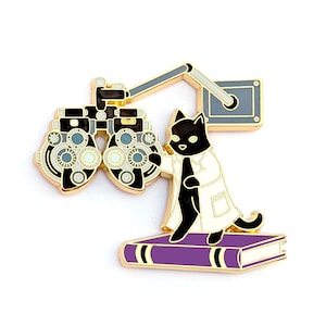 May include: A white ceramic mug with a black handle and the text "But First, Coffee" in a black, handwritten-style font. The mug is on a white surface.