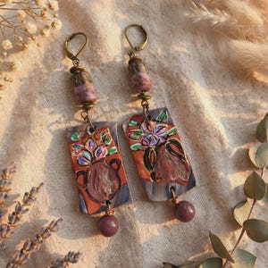 Long earrings, floral amphora design, handcrafted potter's beads. Purple spun glass stem. Sleeper earrings.