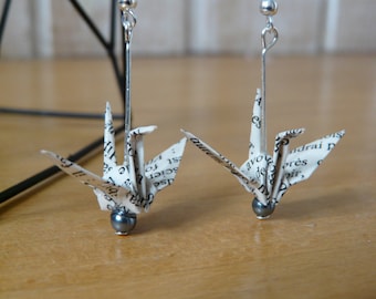 Origami crane earrings on book paper