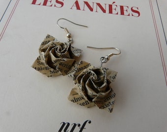 Literary pink origami earrings on book paper