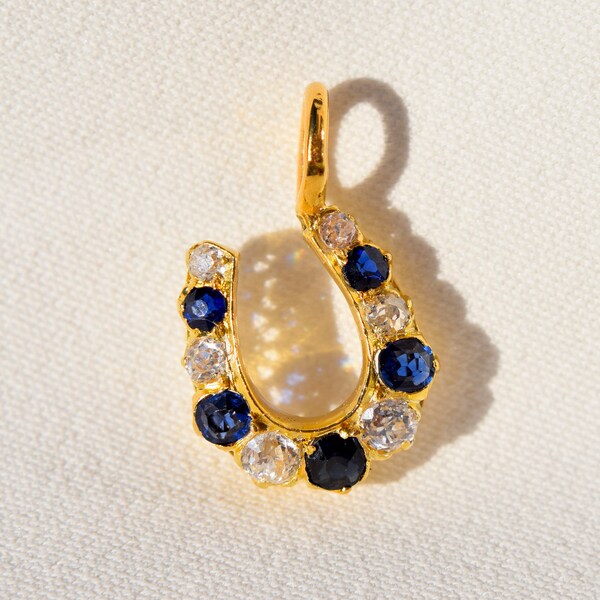 Antique 18ct yellow gold, old mine cut diamond and sapphire horseshoe pendant, made in Germany around 1900