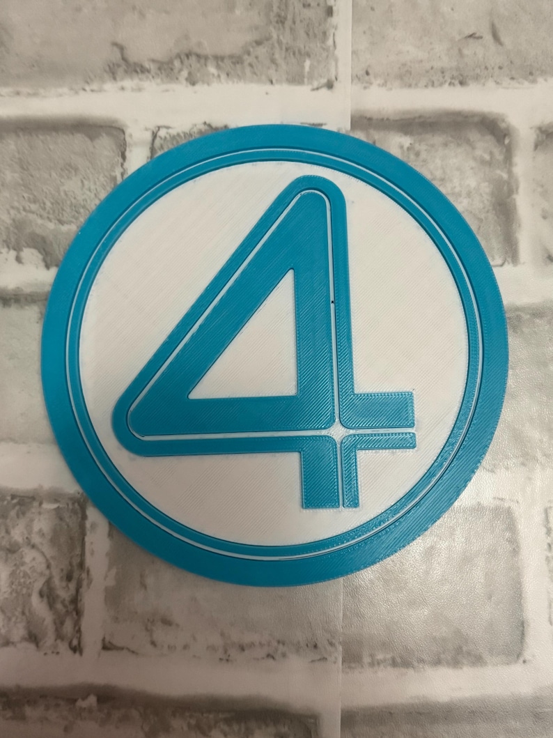 May include: A circular emblem featuring a prominent number four in a bold, stylized font. The design consists of a bright blue raised border and a matching blue number four set against a flat, white circular background, creating a clean contrast.