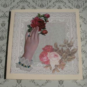 291 Carte de voeux  main tendue avec des roses