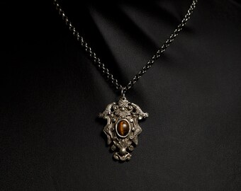 elegant Edwardian style silver pendant with gold tiger's eye