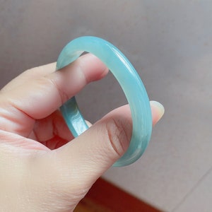 Grade A Jadeite bangle  bluish green Oval 54.7 mm by 47.5 mm ( Fits 51 - 53 mm round)