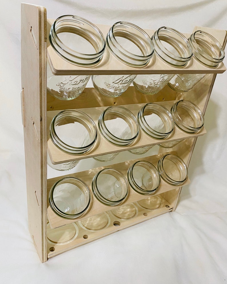 This mason jar organizer can also work perfectly for your canned goods! Organize canned goods with these pantry organization and storage projects, products, and ideas.