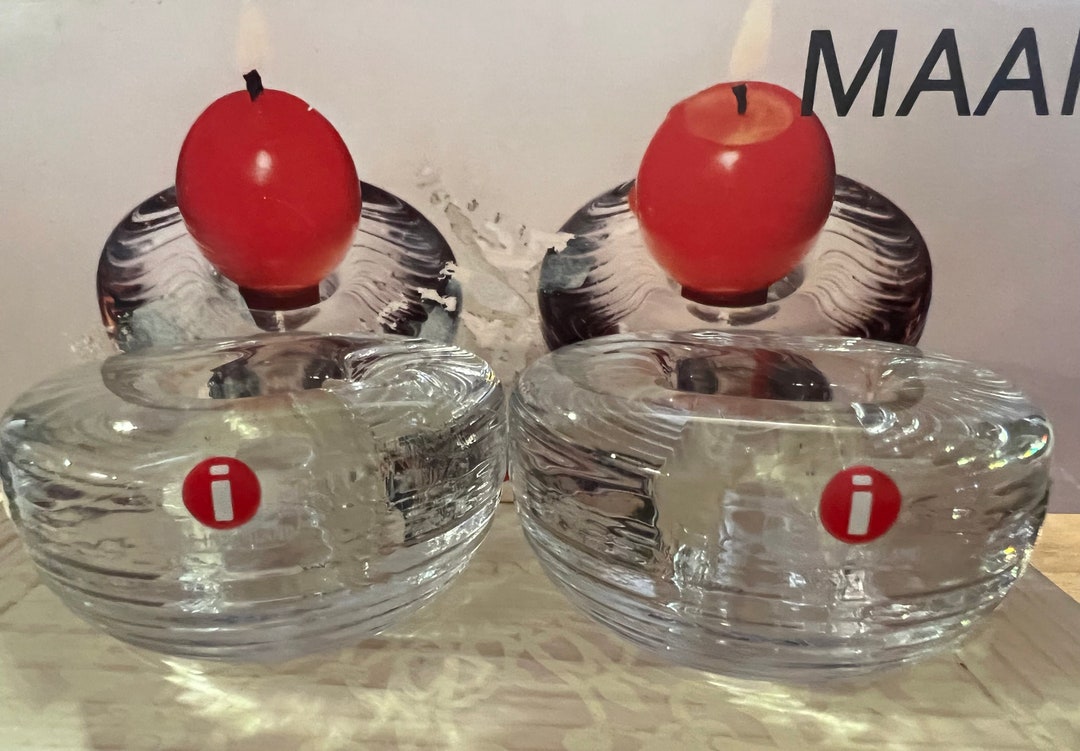 A Set of Two Iittala Maaru Candle Holders and Candles in Their Original