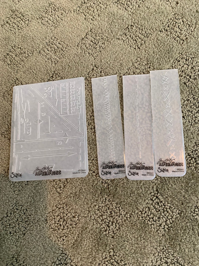 set of four Tim Holtz Sizzix Alterations Embossing Folders