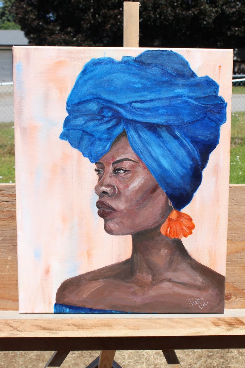 May include: A painting of a woman with dark skin wearing a blue turban and a large orange earring. The background is a light peach color.