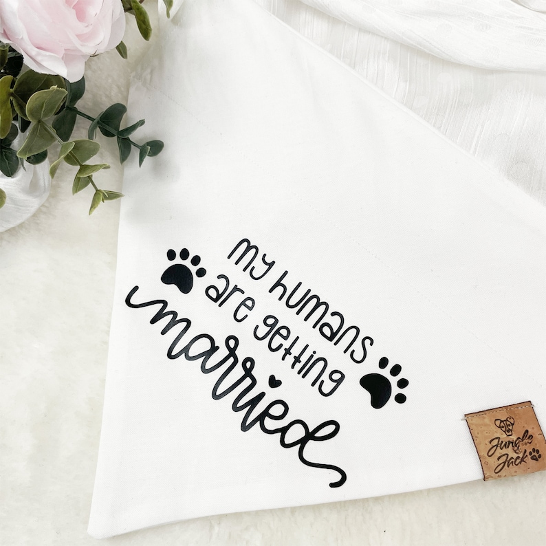 May include: White cotton bandana with black paw prints and the text "My humans are getting married".