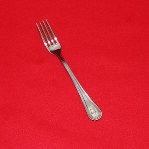 May include: A set of three ceramic mugs with a speckled, matte finish. The mugs are in shades of cream, light gray, and dark gray. Each mug has a simple, minimalist design, perfect for coffee or tea.