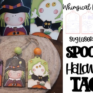 May include: Three wooden Halloween tags featuring a witch, ghost, and pumpkin design. The tags are decorated with colourful paint and have a string attached to them. The tags are on a wooden surface. The text "Whimsical Inkling" and "Spooky Halloween Tags" is visible in the image.