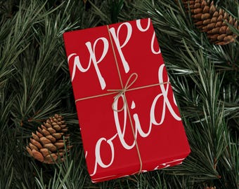 Papel de regalo de Navidad con el mensaje "Felices Fiestas".