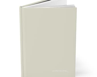 May include: A light green journal with the words "write to me..." printed on the front cover.
