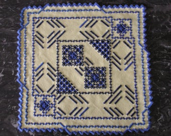 Square doily embroidered in Hardanger yellow and blue