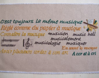 Embroidery sayings on music at the cross point