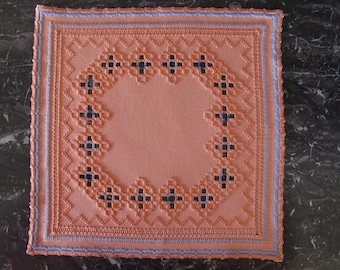 Orange and blue Hardanger embroidered doily