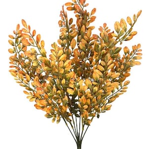 May include: Artificial bush with small, oval-shaped leaves in shades of yellow, orange, and green. The leaves are clustered densely on multiple stems, creating a full, textured appearance. The stems converge into a single, brown-colored base, suitable for floral arrangements or decorative displays.