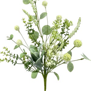 May include: A faux floral arrangement featuring a variety of green foliage and white accents. The bouquet includes round, textured blooms, long sprigs, and various leaf shapes, creating a natural, textured look. The stems are a dark green.