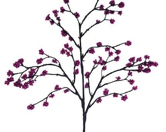 May include: A decorative artificial branch with dark gray stems and vibrant magenta berry clusters. The berries are clustered along the branches, creating a visually appealing floral accent. Perfect for adding a touch of color to any space.