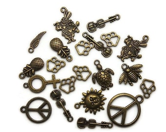 Lot Breloques pendentifs en alliage Tibétain motif variés coeur fleur peace fruit animaux couleur bronze