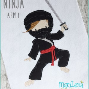May include: A black and red ninja applique with a sword. The ninja is wearing a black mask and a red belt. The text "NINJA APPLI" is at the top of the image.