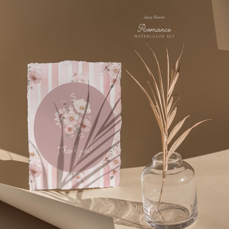 May include: A watercolor greeting card with a pink and white striped background and a pink circle with floral accents. The card says "Thank you!" in script. A clear glass vase holds a dried plant stem.