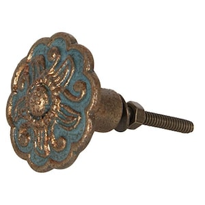 May include: Decorative cabinet knob with a floral design. The knob features a teal and bronze finish with a detailed, embossed pattern. The hardware includes a threaded bolt for installation. The knob is designed for furniture and home decor.