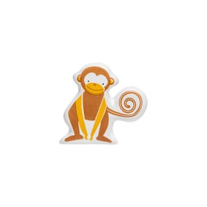May include: A brown monkey with a yellow tail and a yellow band around its waist. The monkey is smiling and has a white background.