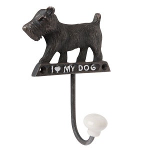 May include: A black cast iron dog hook with a white ceramic knob. The dog is a terrier with the words "I love my dog" on the base.