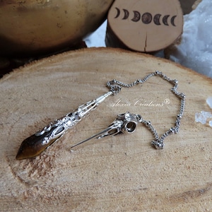 Divinatory pendulum with Tiger&#39;s Eye tip and silver metal lace