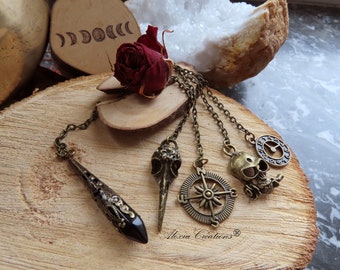 Divination pendulum with black obsidian point and bronze colour pendant: raven skull, compass rose, clock or skull.
