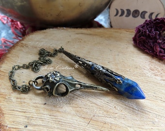 Divinatory pendulum with Lapis Lazuli tip, bronze-colored metal lace and Raven Skull.