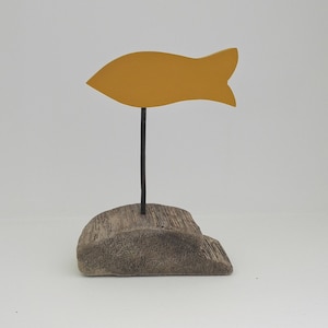 Yellow fish on driftwood base