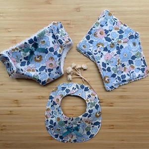 Bib, diaper and 2 doll wipes kit.