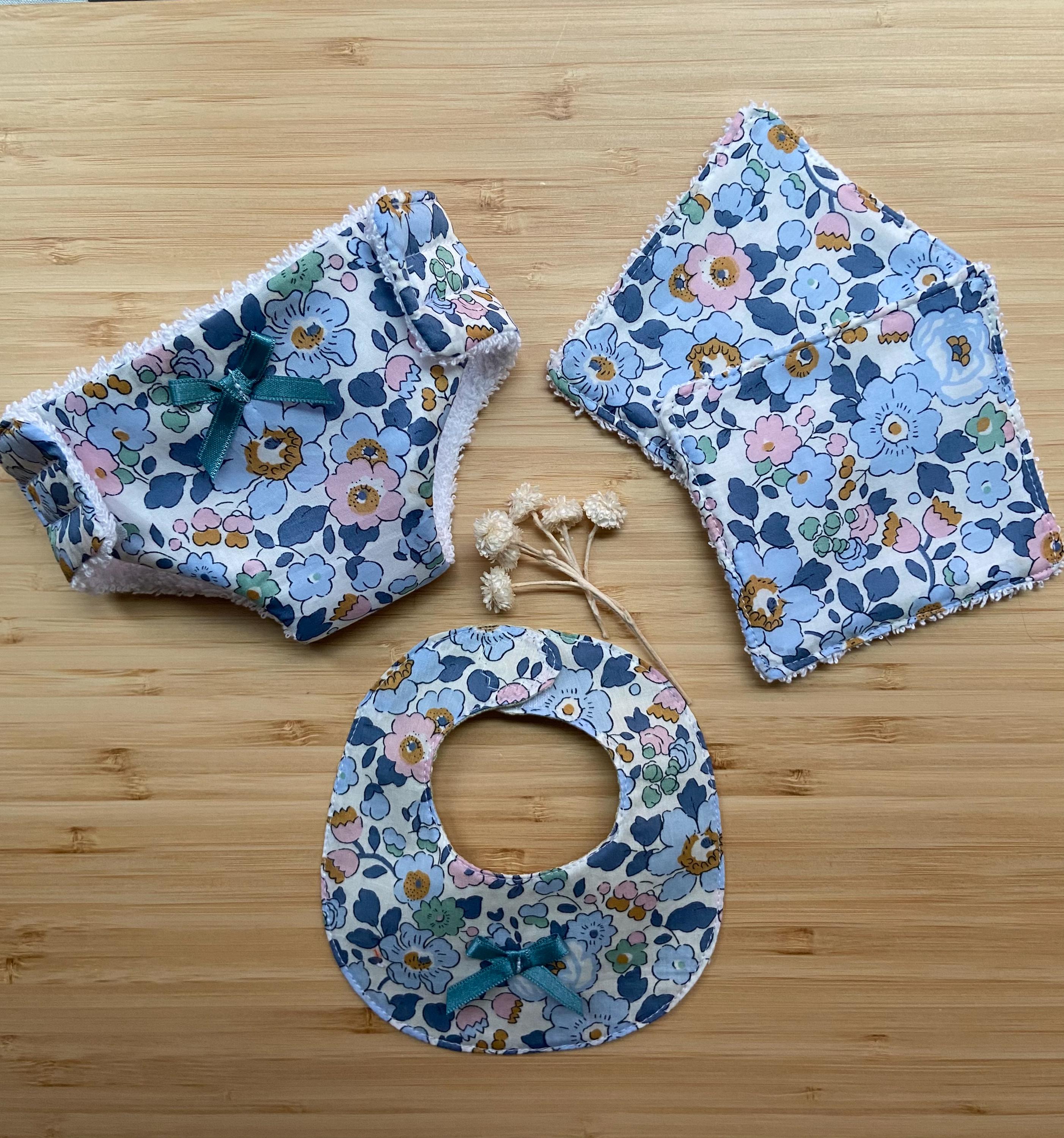 Bib, diaper and 2 doll wipes kit.