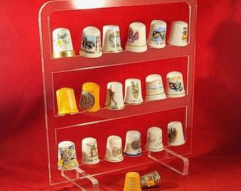 Soporte de exhibición de plexiglás para 18 dedales de colección.