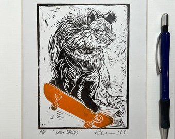 Bear Skills - Bear on a Skateboard - linocut print in brown and orange