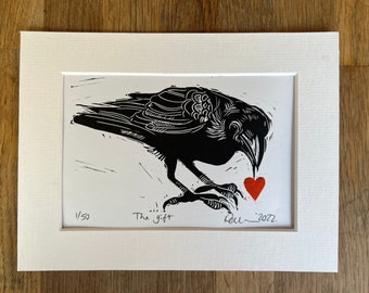 The Gift - Limited Edition linocut print of a crow with a heart.