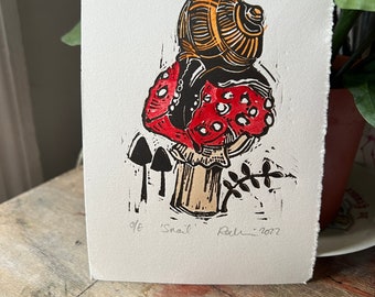 Snail [on a toadstool]  - original hand coloured Linocut