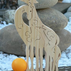 Animal puzzle &quot;the Giraffe family&quot; in cut-out wood