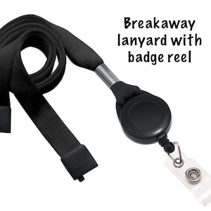 May include: Black breakaway lanyard with badge reel. The lanyard is made of a woven black material and features a black badge reel and a clear plastic badge holder. The text "Breakaway lanyard with badge reel" is printed on the image.