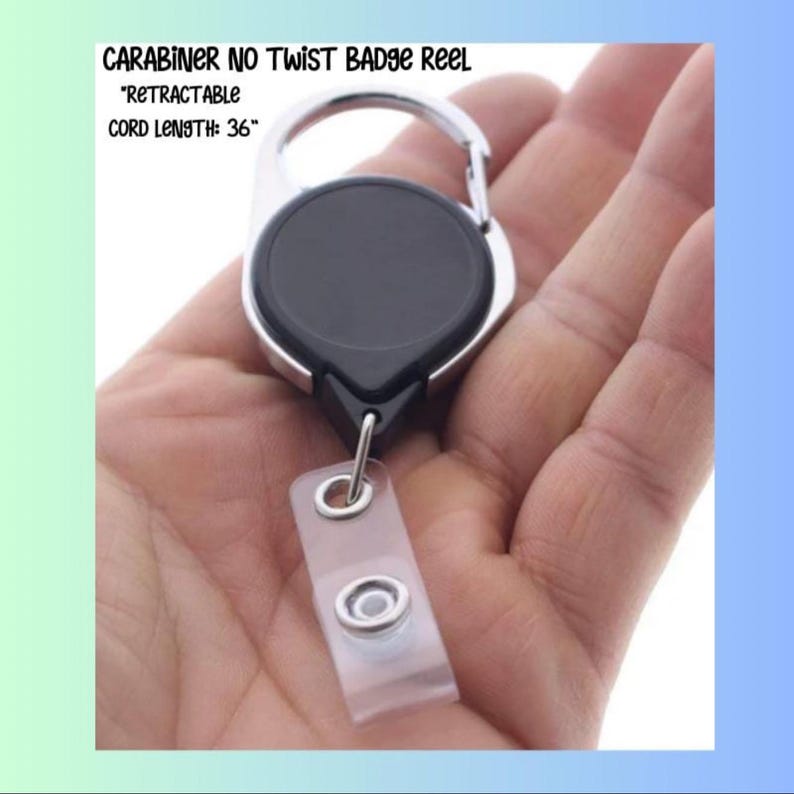 May include: A black and silver carabiner no-twist badge reel with a retractable 36-inch cord. The reel has a clear plastic badge holder attached. Text on the image reads: "CARABINER NO TWIST BADGE REEL", "RETRACTABLE", and "CORD LENGTH: 36".
