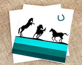 wild horses stallions greetings good luck card galloping rearing horseshoe blank inside green stripes black silhouettes horse lovers riders