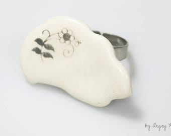 Unglazed white ceramic with flower pattern